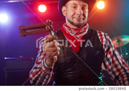 The drummer plays percussion. 38019848