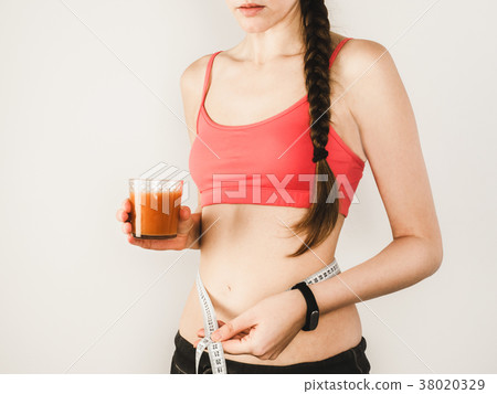 Stylish woman during exercises with dumbbells 38020329