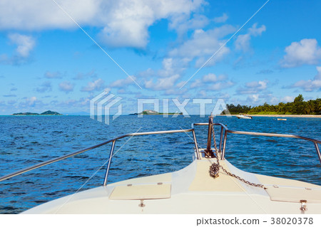 Tropical island and boat 38020378