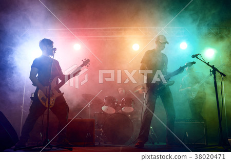 Guitarist and bass player perform on stage. 38020471