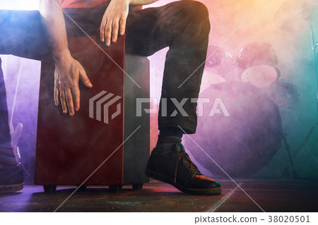 Musician plays the Cajon on stage. 38020501