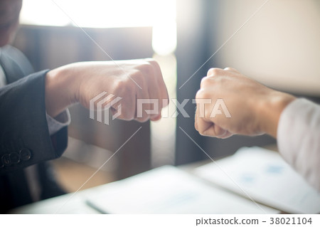 two business man use hand to fist bump two business man use hand to fist bump 38021104