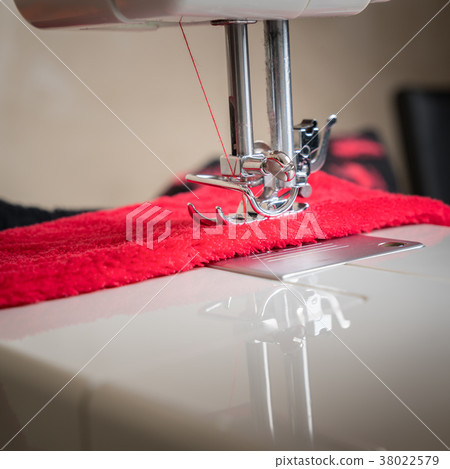 Sewing process in the phase of overstitching close up 38022579