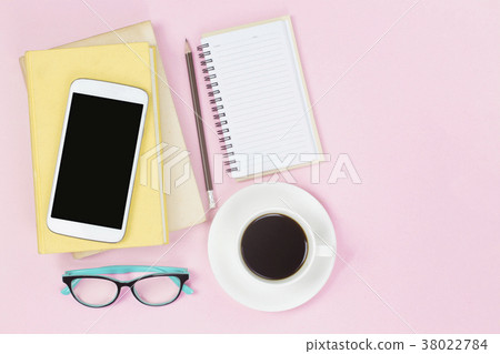 Mobile on old two books notebook pencil glasses Mobile on old two books notebook pencil glasses 38022784