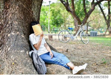 Education Concepts. Asian women reading books in the park. Beaut 38023830