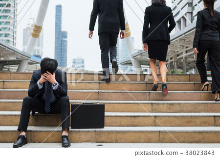Desperate or Stress Businessman sit on stair Desperate or Stress Businessman sit on stair 38023843