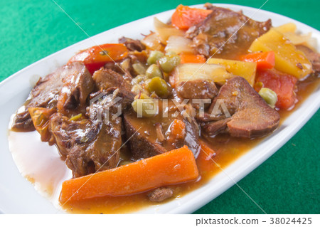 Pork tongue stew on the plate 38024425