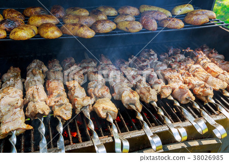 Roasted meat barbecue on the grill. Roasted meat barbecue on the grill. 38026985