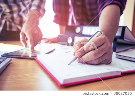 Close up casual business man signing contract Close up casual business man signing contract 38027030
