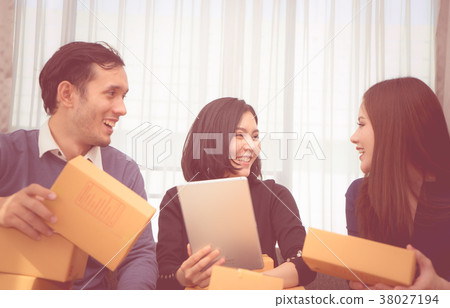 Team of start up online business owner discussing 38027194