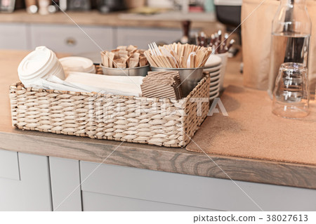 A table setting for coffee on the counter at a A table setting for coffee on the counter at a 38027613