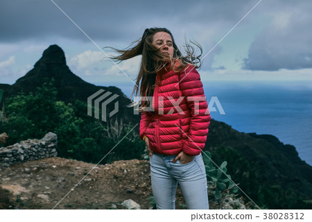 Pretty girl of background of mountain landscape Pretty girl of background of mountain landscape 38028312