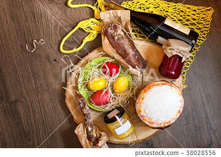 Colorful easter eggs in a basket with cake, red 38028556