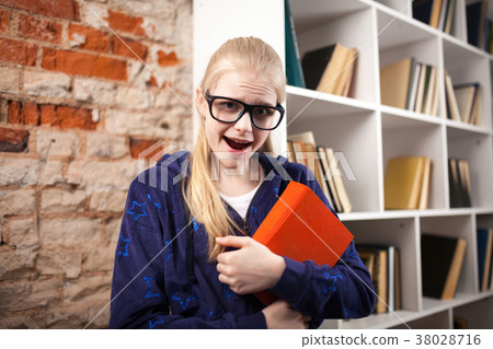 Teenage girl in a library 38028716