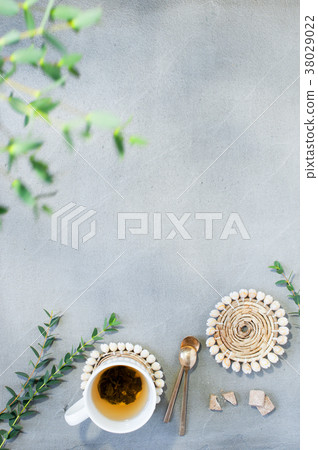 he cup of tea on the gray table, sunny morning 38029022