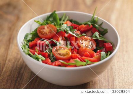 fresh salad with cherry tomatoes and arugula 38029804