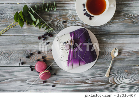 Hands going to eat dessert, yellow mousse cake Hands going to eat dessert, yellow mousse cake 38030407
