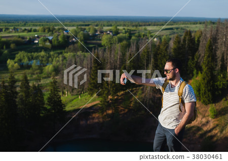 Young stylish man with a beard wearing sunglasses 38030461