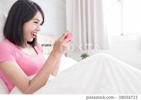 woman play mobile game woman play mobile game 38038715