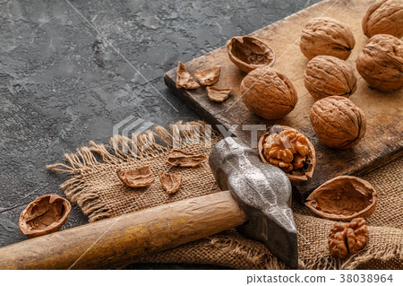 Walnuts  on a cutting board. Healthy food concept Walnuts  on a cutting board. Healthy food concept 38038964