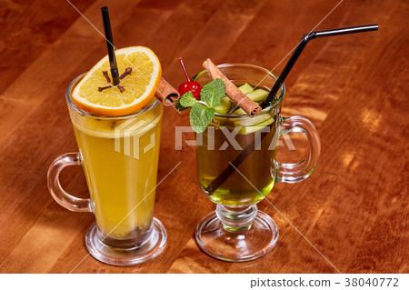 Two glasses of mulled wine with orange, cinnamon 38040772