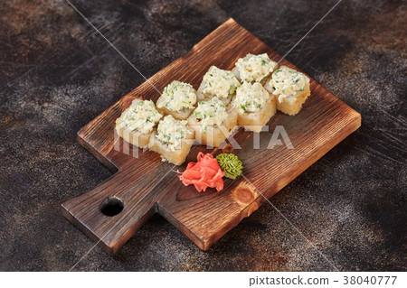 Japanese food sushi maki rolls on wooden board 38040777