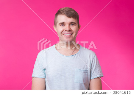 Funny young man looking at camera and smiling on Funny young man looking at camera and smiling on 38041615