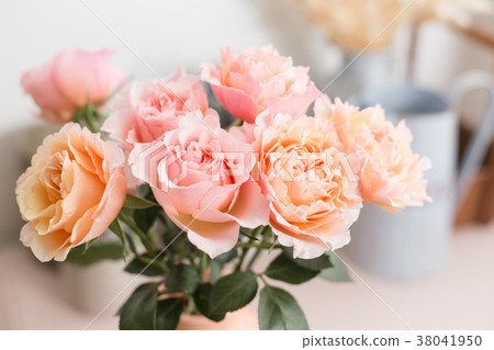 Bouquet flowers of pink roses in glass vase 38041950