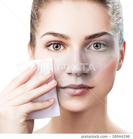Young woman cleaning her face by napkins. Young woman cleaning her face by napkins. 38044296
