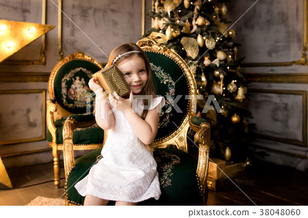 little smiling girl with christmas gift box. little smiling girl with christmas gift box. 38048060