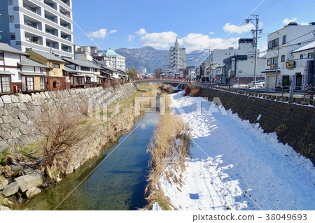 Woman Toba River flowing along Nawate Street 38049693