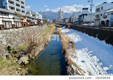 Woman Toba River flowing along Nawate Street 38049694