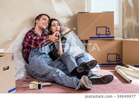 Young couple day dreaming about their future after 38049977