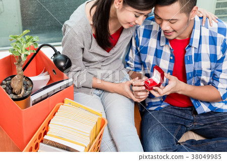 Young Indonesian man makes proposal to girlfriend Young Indonesian man makes proposal to girlfriend 38049985