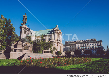 Adam Mickiewicz Statue and Carmelite Church in Warsaw 38053745