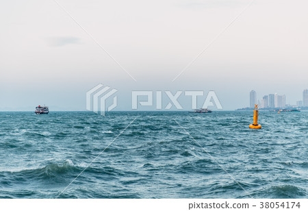 calm sea ocean city coast skyline in evening 38054174