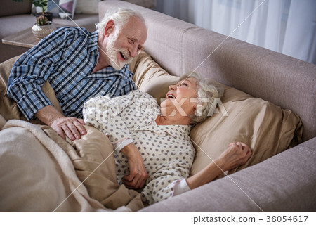Happy elderly man and woman waking up Happy elderly man and woman waking up 38054617