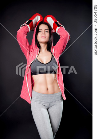 Sporty sexy girl in boxing gloves Sporty sexy girl in boxing gloves 38054709