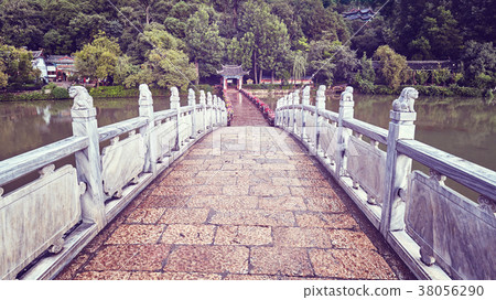 Bridge in the Jade Spring Park in Lijiang, China. Bridge in the Jade Spring Park in Lijiang, China. 38056290