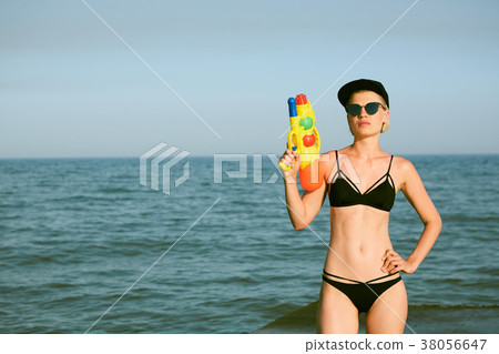 Happy young woman in a cap with the word queen Happy young woman in a cap with the word queen 38056647