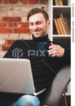Young man with a laptop Young man with a laptop 38056672