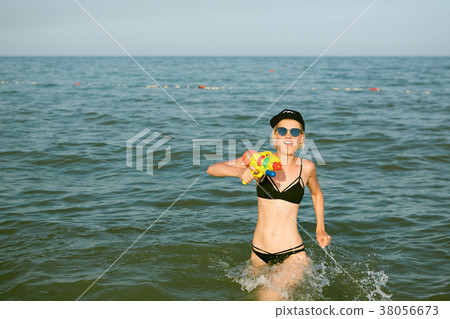 Happy young woman in a cap with the word queen Happy young woman in a cap with the word queen 38056673