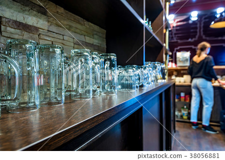 Bar shelf with empty beer glasses 38056881