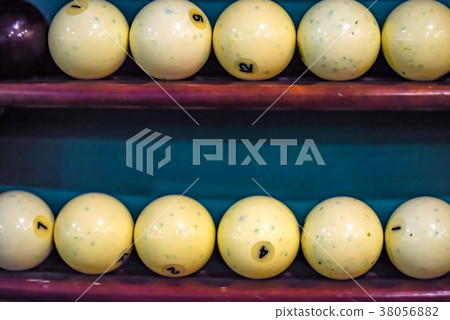 White billiard balls on shelf close White billiard balls on shelf close 38056882