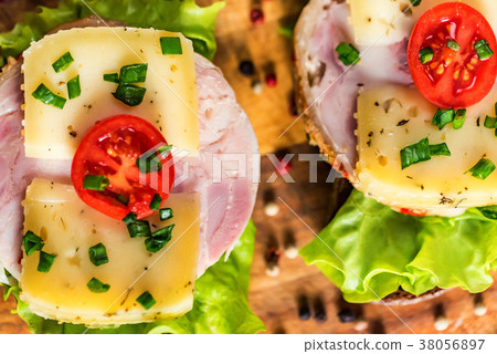 Sandwiches with cheese, turkey, lettuce and tomato Sandwiches with cheese, turkey, lettuce and tomato 38056897