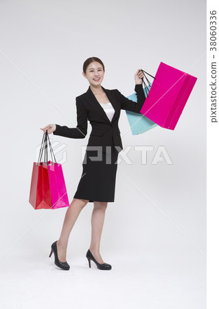 Everyday life of beautiful young woman, shopping, working concept photo in studio shot white background. 156 Everyday life of beautiful young woman, shopping, working concept photo in studio shot white background. 156 38060336