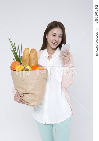 Everyday life of beautiful young woman, shopping, working concept photo in studio shot white background. 032 38060362