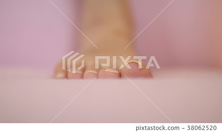 Young woman suffering from curly nails 38062520