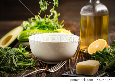 Lettuce and a bottle of olive oil Lettuce and a bottle of olive oil 38068462