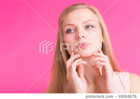 Beautiful blonde girl portrait with hands for 38068876